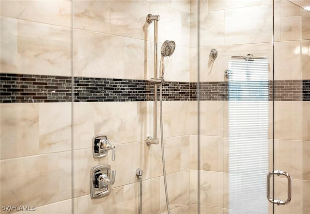 interior details featuring a stall shower