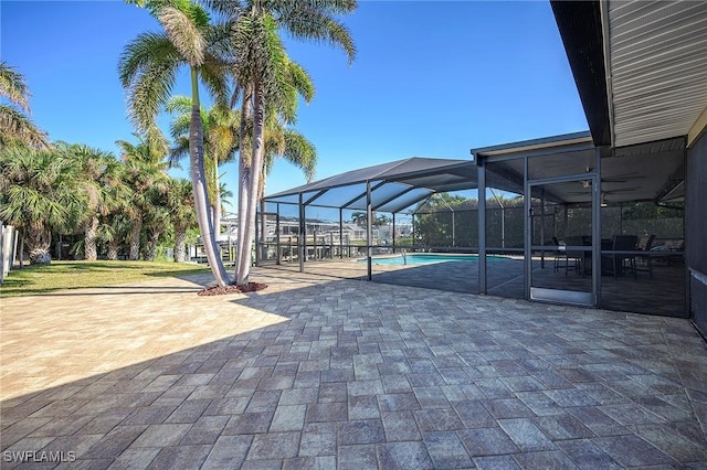 view of patio featuring a lanai and an outdoor pool