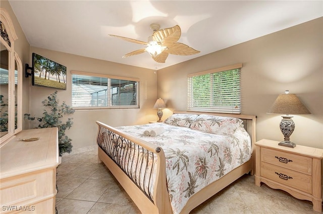 bedroom with light tile patterned flooring and a ceiling fan