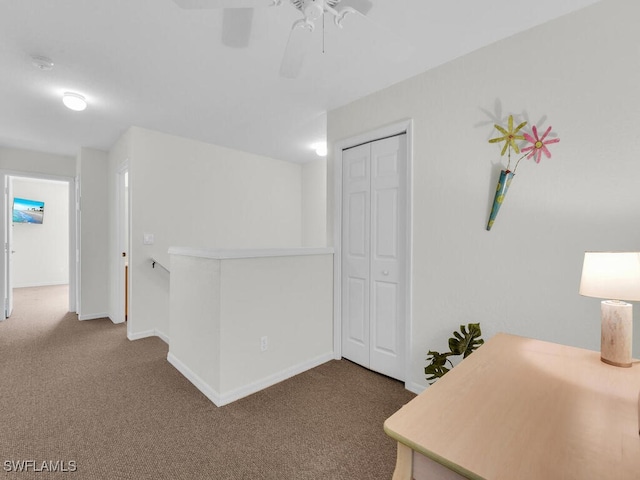 7539 Berkshire Pines Dr, Naples, FL 34104 - hallway with an upstairs landing, carpet flooring, and baseboards