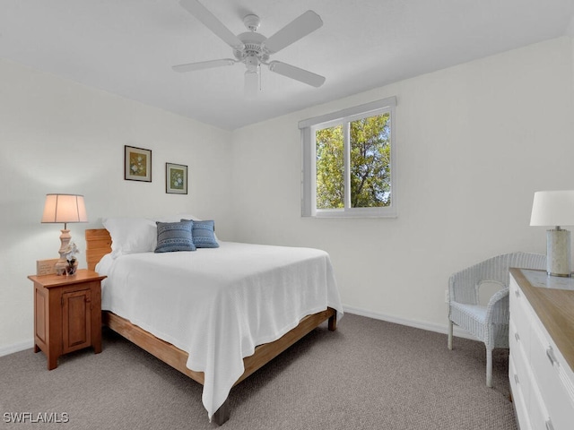 7539 Berkshire Pines Dr, Naples, FL 34104 - bedroom with light carpet, baseboards, and a ceiling fan