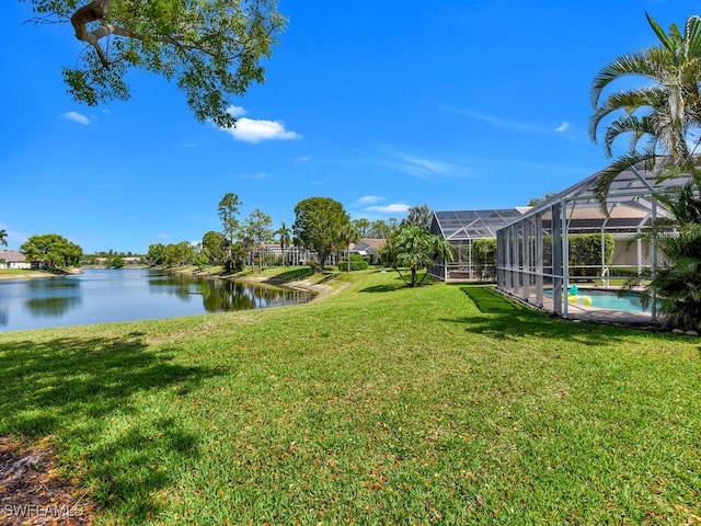 7539 Berkshire Pines Dr, Naples, FL 34104 - view of green lawn with a water view and an outdoor pool