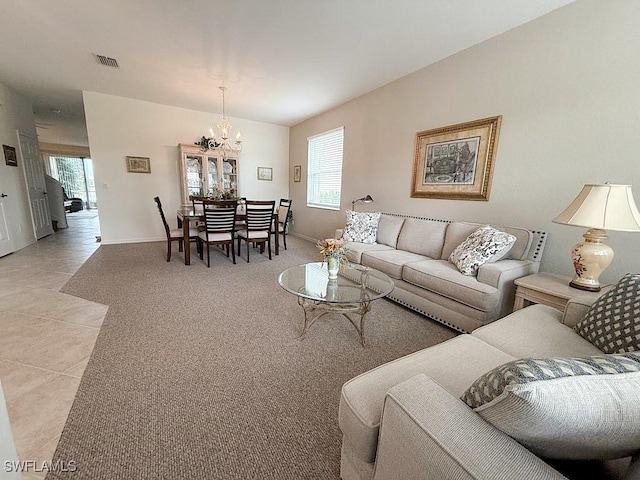 7539 Berkshire Pines Dr, Naples, FL 34104 - living area featuring a chandelier, baseboards, and light tile patterned floors