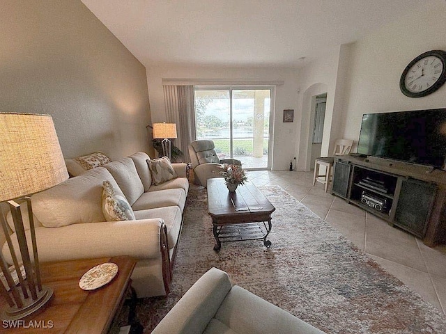 7539 Berkshire Pines Dr, Naples, FL 34104 - tiled living room with arched walkways