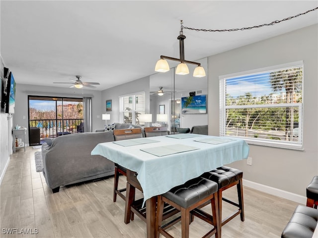 6893 Estero Blvd Unit 416, Fort Myers Beach, FL 33931 - dining area with a ceiling fan and light wood-style floors