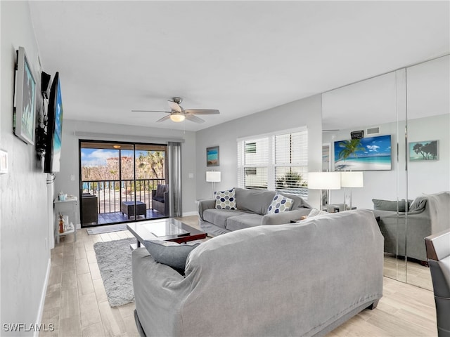 6893 Estero Blvd Unit 416, Fort Myers Beach, FL 33931 - living area with plenty of natural light, a ceiling fan, and light wood-type flooring