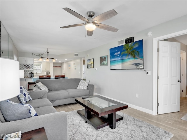 6893 Estero Blvd Unit 416, Fort Myers Beach, FL 33931 - living area with light wood finished floors and ceiling fan