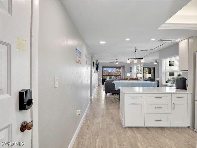 6893 Estero Blvd Unit 416, Fort Myers Beach, FL 33931 - kitchen featuring recessed lighting, white cabinets, light wood-style floors, a ceiling fan, and open floor plan