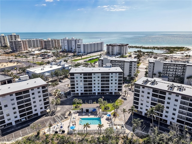 birds eye view of property with a water view and a view of city