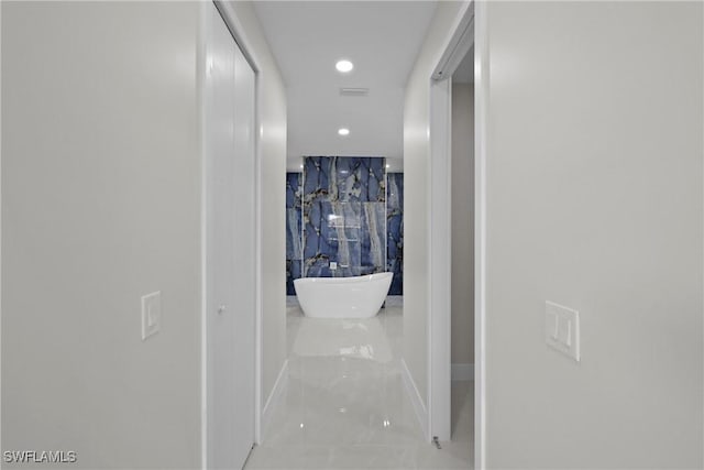 hall featuring recessed lighting
