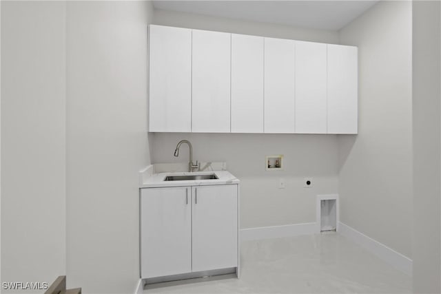 laundry area featuring a sink, cabinet space, washer hookup, electric dryer hookup, and baseboards