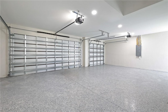 garage featuring a garage door opener and electric panel