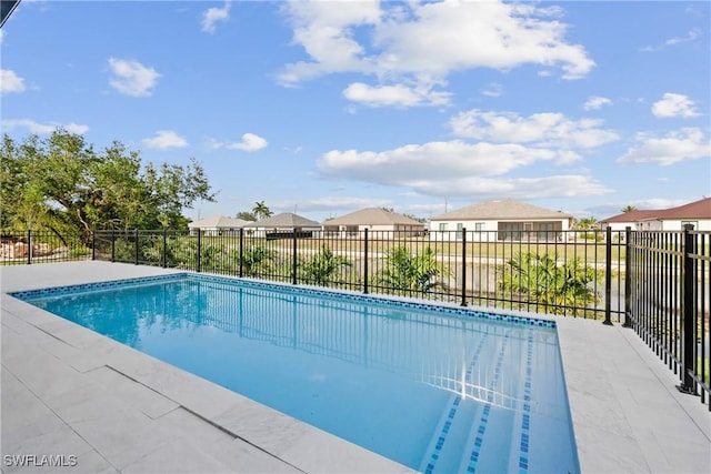 view of pool with fence, a residential view, and a fenced in pool