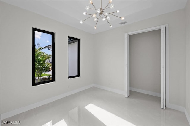 unfurnished bedroom featuring light tile patterned floors, a chandelier, visible vents, and baseboards