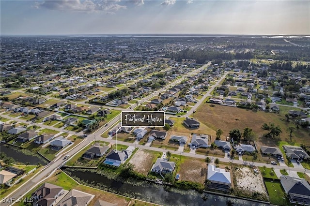 aerial view with a water view and a residential view
