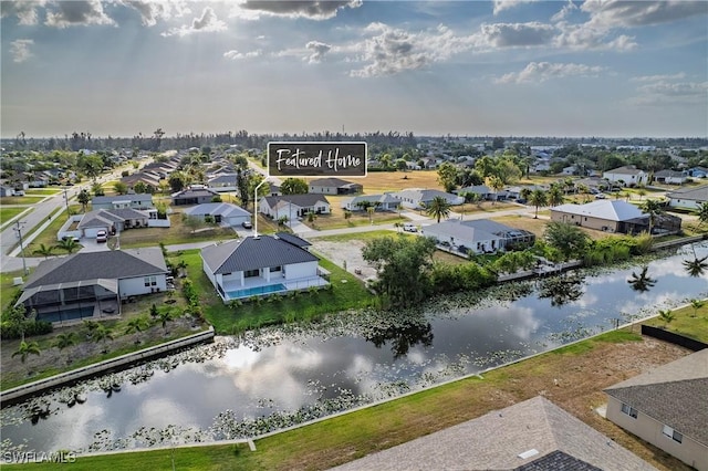 aerial view featuring a residential view and a water view