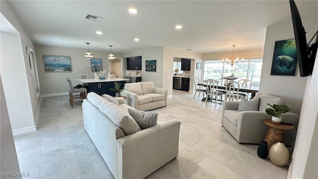 living area with recessed lighting, baseboards, visible vents, and an inviting chandelier