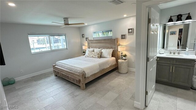 bedroom with a sink, baseboards, recessed lighting, and visible vents