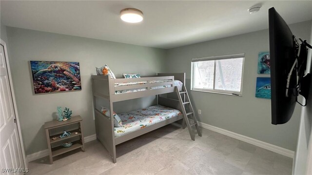 bedroom featuring baseboards