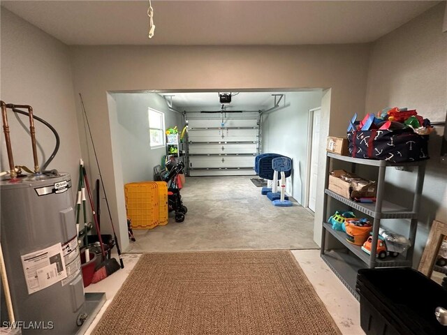 garage featuring a garage door opener and electric water heater
