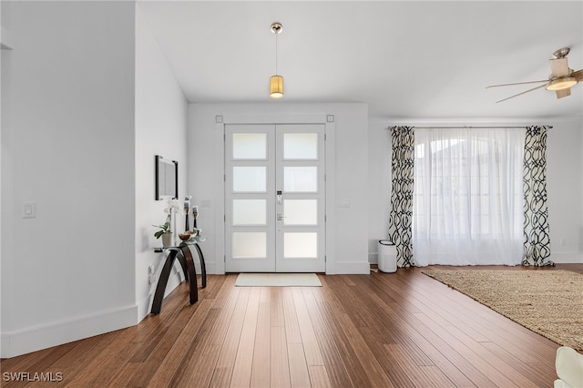 213 SE 6th St, Cape Coral, FL 33990 - foyer with baseboards, french doors, ceiling fan, and wood finished floors