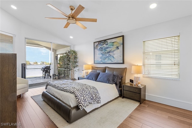 213 SE 6th St, Cape Coral, FL 33990 - bedroom featuring access to outside, recessed lighting, wood finished floors, and vaulted ceiling