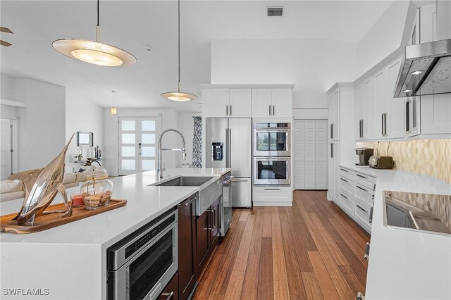 213 SE 6th St, Cape Coral, FL 33990 - kitchen featuring visible vents, pendant lighting, light countertops, a sink, and stainless steel appliances