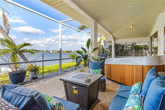 213 SE 6th St, Cape Coral, FL 33990 - view of patio / terrace with a hot tub, area for grilling, a water view, an outdoor living space, and glass enclosure