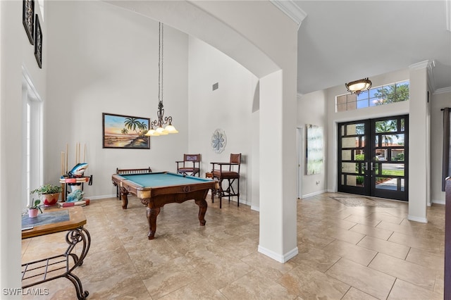 14790 Fripp Island Ct, Naples, FL 34119 - game room featuring a towering ceiling, baseboards, billiards, french doors, and ornamental molding