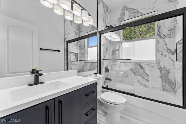 14790 Fripp Island Ct, Naples, FL 34119 - full bath with combined bath / shower with glass door, vanity, toilet, and marble finish flooring
