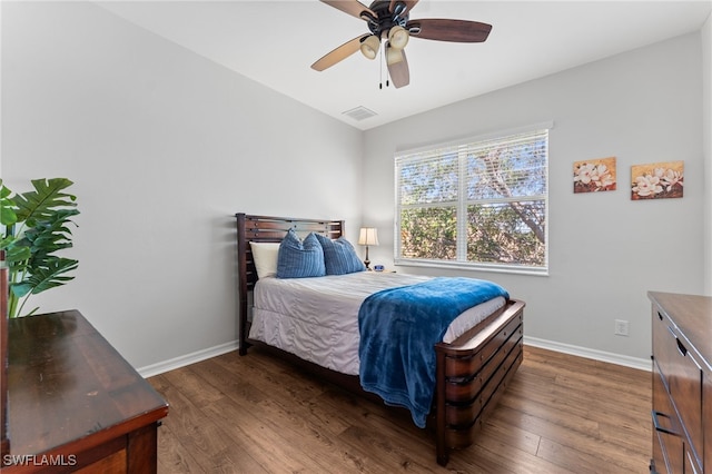 14790 Fripp Island Ct, Naples, FL 34119 - bedroom with baseboards, dark wood-style floors, and ceiling fan