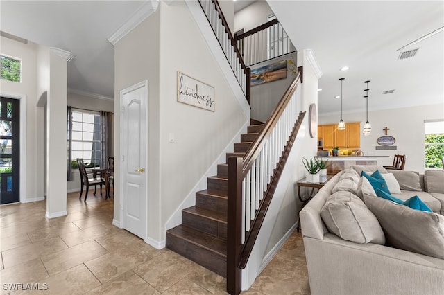 14790 Fripp Island Ct, Naples, FL 34119 - staircase featuring baseboards, ornamental molding, and recessed lighting
