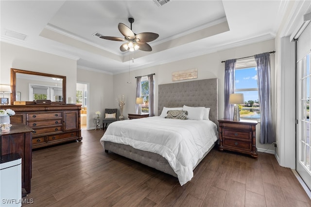 14790 Fripp Island Ct, Naples, FL 34119 - bedroom featuring a raised ceiling, dark wood-style floors, ornamental molding, and a ceiling fan