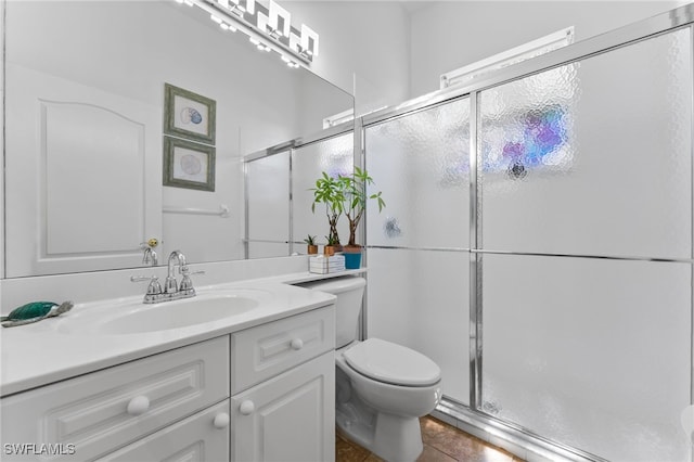 14790 Fripp Island Ct, Naples, FL 34119 - bathroom with toilet, a shower stall, vanity, and tile patterned flooring