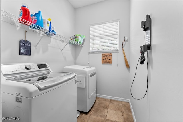 14790 Fripp Island Ct, Naples, FL 34119 - washroom featuring washer and clothes dryer and baseboards
