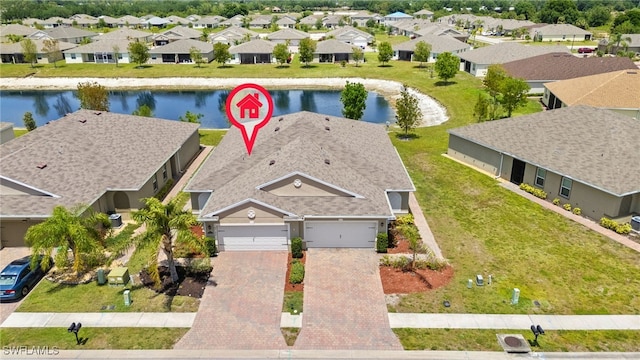 aerial view featuring a residential view and a water view