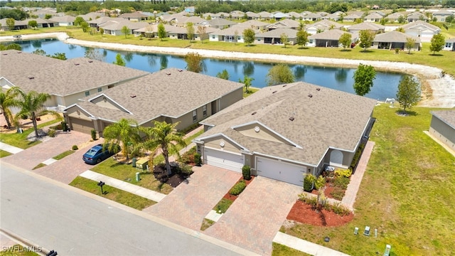 aerial view featuring a residential view and a water view