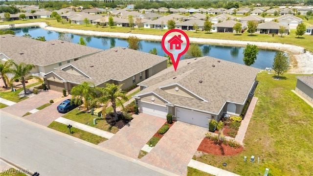 aerial view with a water view and a residential view