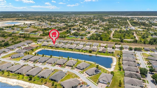 bird's eye view with a residential view and a water view