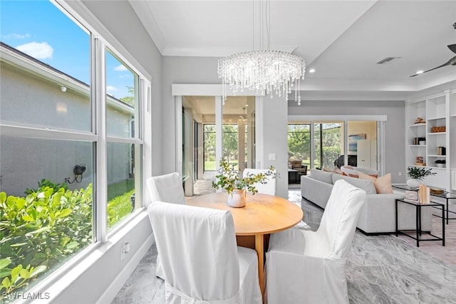 dining space featuring visible vents, crown molding, built in shelves, an inviting chandelier, and recessed lighting