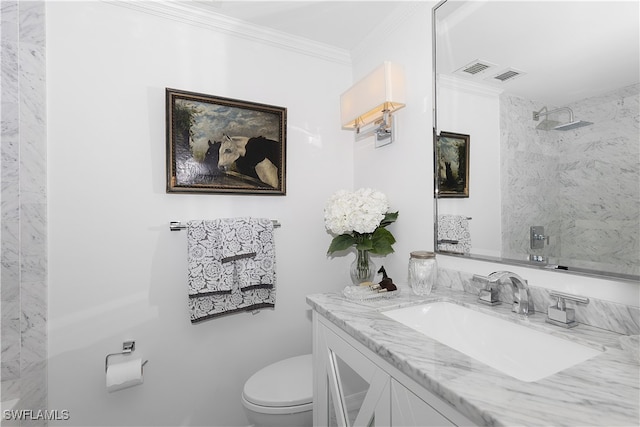 bathroom featuring a shower, vanity, toilet, and crown molding