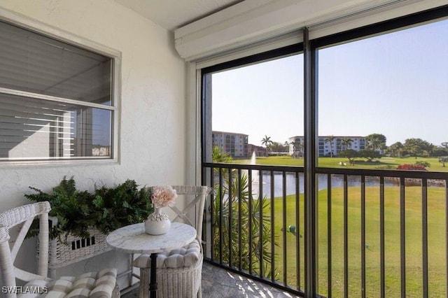 balcony featuring a water view