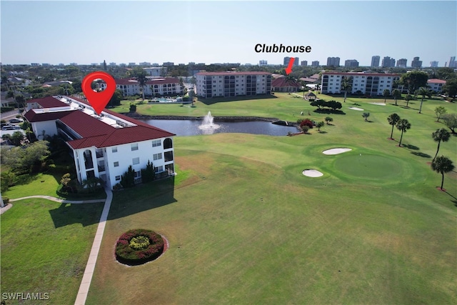 bird's eye view with a water view and view of golf course