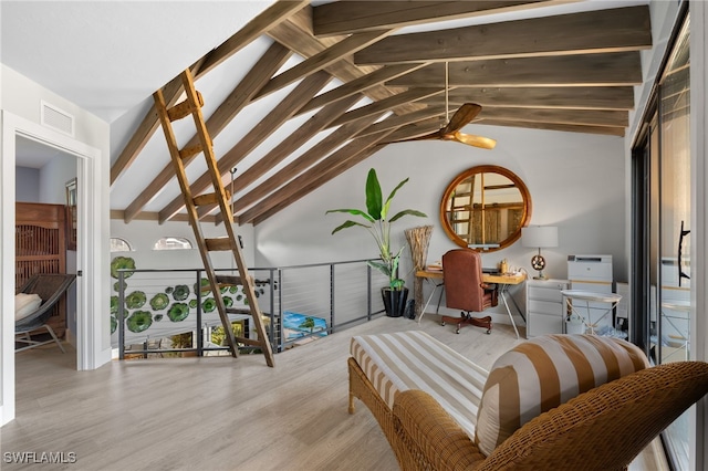 interior space with visible vents, lofted ceiling with beams, and wood finished floors