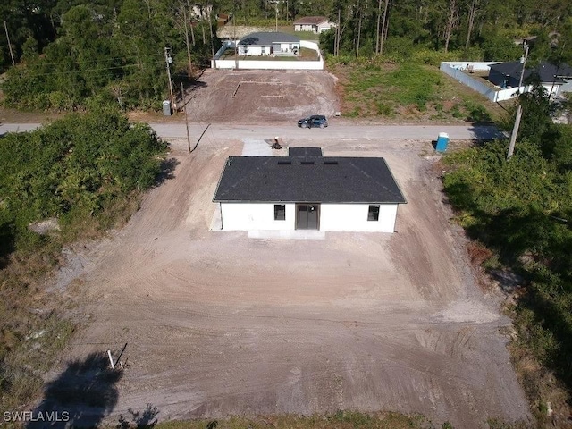 463 Latic Ave S, Lehigh Acres, FL 33974 - view of subject property with a heavily wooded area