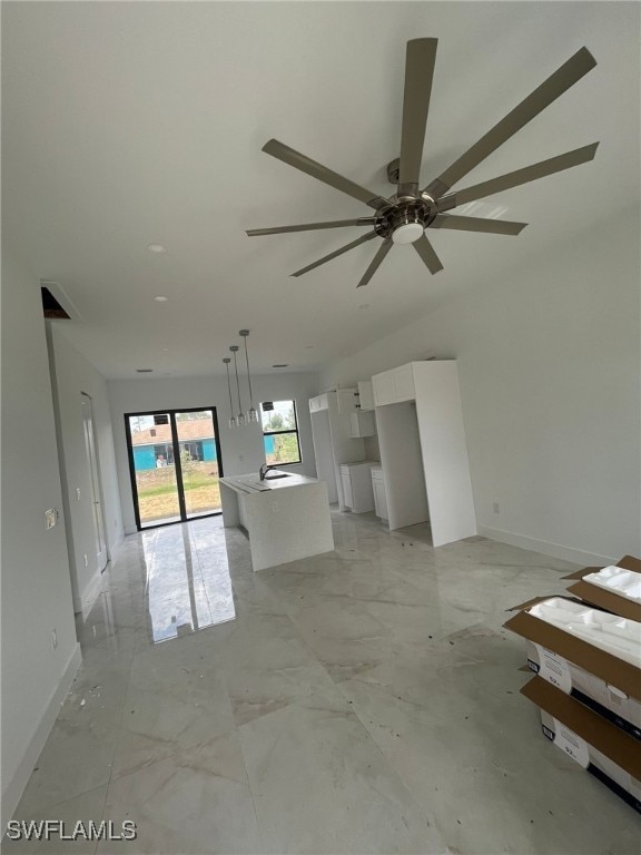 463 Latic Ave S, Lehigh Acres, FL 33974 - unfurnished living room with a ceiling fan and baseboards