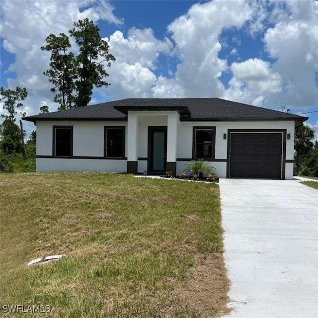 463 Latic Ave S, Lehigh Acres, FL 33974 - view of front of house with stucco siding, a garage, concrete driveway, and a front yard