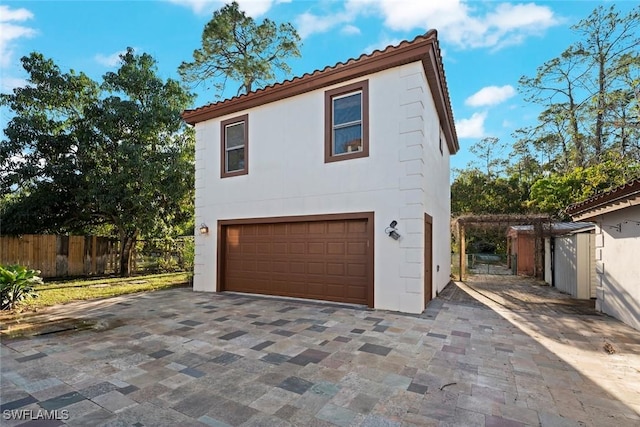 exterior space featuring fence and driveway