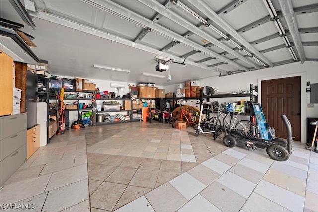 garage featuring a garage door opener
