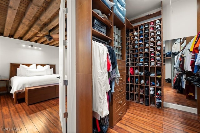 interior space featuring hardwood / wood-style flooring and beamed ceiling